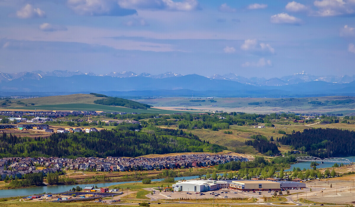 Aerial view of the Town of Cochrane, looking toward the mountains.